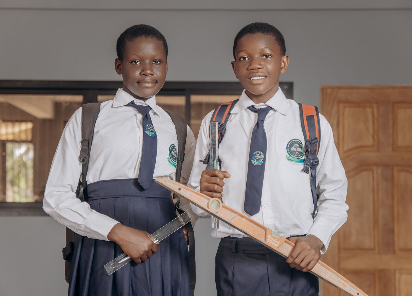 Holy Trinity students holding their technical drawing tools